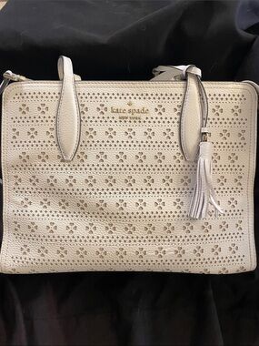 kate spade Cream Perforated Leather Tote with Tassel Accent